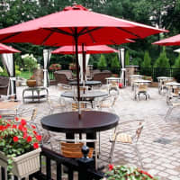 <p>Red accents are seen in Locale&#x27;s flower boxes and cheery umbrellas on the Closter restaurant&#x27;s patio.</p>