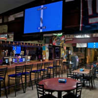 <p>The interior of The Lumberyard Pub is filled with lots of TVs for primetime game viewing.</p>