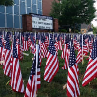 <p>Flags were displayed across the high school lawn.</p>