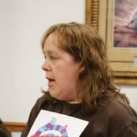 <p>Jane Sparling leads a group of moms through a game of Momsense at a monthly meeting.</p>