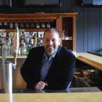 <p>Matt Van Allen stands behind the bar at the Old Forge Spirits &amp; Pub in Ringwood.</p>