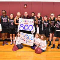 <p>The girls basketball team at Wooster School in Danbury celebrates with Coach Dave MacNutt as records his 800th career varsity basketball win.</p>