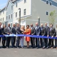 <p>State, city and county officials cut the ribbon at the official opening of Phase II of the Heritage Homes housing development in New Rochelle this week.</p>