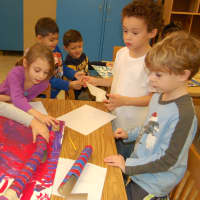 <p>Putnam Valley kindergarten students collaborate on their design on a marble project.</p>