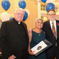 <p>Monsignor Emmet R. Nevin of St. Paul – St. Ann in Congers and Martha Robles, executive director of Catholic Charities Community Services of Rockland, present Alex Bursztein of Legal Aid Society of Rockland with the Community Service Award.</p>