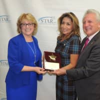 <p>Mayor Harry Rilling and his wife, Lucia, receive Humanitarians of the Year Award from STAR.</p>