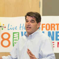 <p>Fort Lee Mayor Mark Sokolich addresses attendees at a wellness event.</p>