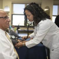 <p>Lyndhurst Mayor Robert B. Giangeruso took a moment to have his blood pressure checked by Nurse Practitioner Faith Fajarito</p>
