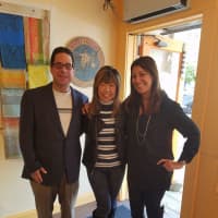 <p>Michael Mazella, left, owner and operator of The Seafood Grill in Armonk is calling his new dock-to-dish restaurant a &quot;love letter&quot; to the hamlet. With Mazella is his wife, Taeko, middle, and an unidentified friend.</p>
