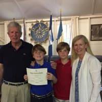 <p>Connor McNamara (second from left) was accompanied by his father, John, brother Mark and mother, Christa when he received his award for winning the CTDAR statewide Fifth Grade Essay Competition at Matthies Hall</p>