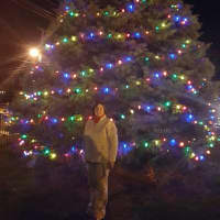 <p>Greiner by the Christmas tree she helped light at the Cortlandt Engine Company’s firehouse in Montrose.</p>