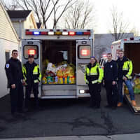 <p>Members of the Norwood EMS piled the items locals donated into an ambulance and a trailer.</p>