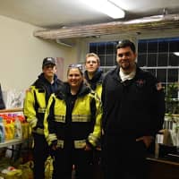<p>Members of the Norwood EMS stand with some of the items they helped collected at their recent supplies drive.</p>