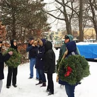 <p>Members of the Wyckoff Area Garden Club and other volunteers prepare to lay wreaths on veteran graves earlier this month.</p>