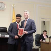 <p>Michael Hunter receives the Youth of the Year Award from White Plains Mayor Thomas Roach.</p>