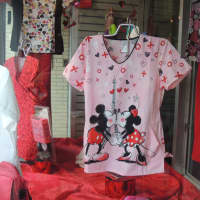 <p>Character scrubs are always popular! Mickey and Minnie kiss in the Valentine&#x27;s Day window.</p>