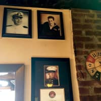 <p>The only pictures on the wall are of military men and women</p>