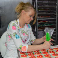 <p>Michele Braun decorates cookies for Teacher&#x27;s Appreciation Week.</p>