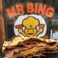 <p>Bings are crepes made with mung bean, rice, and wheat flour and packed with herbs, eggs and meats such as duck, chicken and pork, or sweet fillings such as Nutella, a cocoa-hazelnut paste.</p>