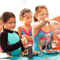<p>Ready. Set. Food fight! A group of kids at the 2016 Muddy Puddles &quot;Mess Fest&quot; gather in the food fight tent.</p>