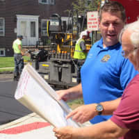 <p>Councilman Mario Karcic, left reviews the street paving map with Council President Rich Hughes.</p>