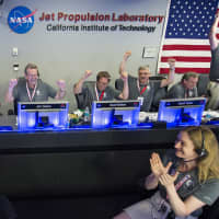 <p>The Juno Team celebrates at the Jet Propulsion Laboratory in California after Juno successfully entered Jupiter&#x27;s orbit.</p>