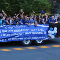 <p>State singles tennis champion Michael Rozenvasser along with the state champion softball and boys swimming team</p>
