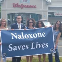 <p>Senator Carlucci, joined by representatives from numerous community outreach and advocacy groups. &quot;Naloxone Saves Lives.&quot;</p>