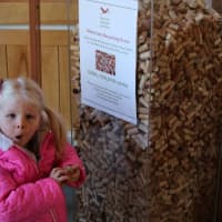 <p>Darien Nature Center student Victoria Dunn with donated corks</p>