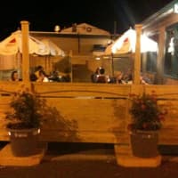<p>Nellie&#x27;s Place of Waldwick has a fenced-in patio where patrons can enjoy the eatery&#x27;s famed thin-crust pizza and Elkin wings.</p>