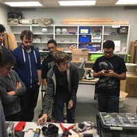 <p>Coach Ryan Paulsen and his &quot;New Ro-Bots&quot; team from New Rochelle High School.</p>
