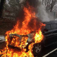 <p>The Nichols Fire Department put out flames after an SUV caught on fire Feb. 10 on the Merritt Parkway southbound entrance ramp.</p>