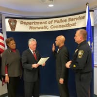 <p>Norwalk Police Department officer Nate Paulino gets promoted to sergeant in a ceremony on Monday.</p>