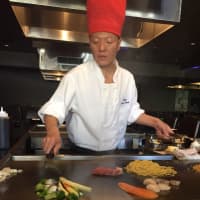 <p>Ooka Sushi &amp; Hibachi Lounge&#x27;s master chef cooks fresh vegetables and other goodies on the grill at the Clifton restaurant.</p>
