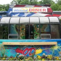 <p>The Oakland Diner is cheerily painted both inside and out.</p>