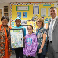 <p>From left, State Sen. Andrea Stewart-Cousins, Olivia Moxey with her winning poster, Lilliana Mandras, another ALMS poster contest participant, art teacher Sarah Glickman and Albert Leonard Middle School Principal John Barnes</p>