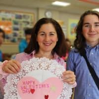 <p>Seventh-grader Ty Amsterdam with his teacher Ilana Brennan. Ty came up with the idea for Pocantico Hills students crafting valentines last week for residents of Atria Briarcliff Manor.</p>
