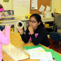 <p>Students at Claremont Elementary School in Ossining work on their model of the new Tappan Zee Bridge.</p>