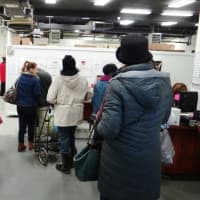 <p>Person-to-Person clients in Norwalk checking in to receive turkeys and fixings.</p>