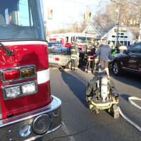 <p>Westport firefighters respond to the scene of an accident at the intersection of Post Road East and Cedar Road.</p>