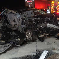 <p>An SUV is heavily damaged in a crash early Monday on I-95 in Westport</p>