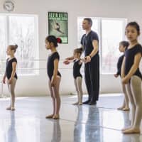 <p>Eugene Petrov in a Level 1 ballet class explaining the correct placement of arms.</p>