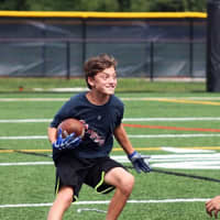 <p>Ossining football players took part in a Pace youth clinic Sunday.</p>