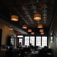 <p>Paisano&#x27;s dark and cozy interior in Rutherford.</p>