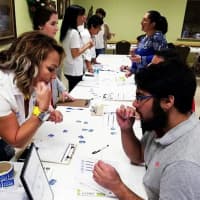<p>Participants at an earlier drive do the simple cheek swab to join the national registry and potentially be a match for Briana Lopez and others.</p>