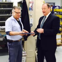 <p>USPS Northeast Area Vice President Edward Phelan presents Franklin Lakes Letter Carrier Paul Dargenzio with his 50 year service pin and congratulatory letter from Postmaster General Megan Brennan.</p>