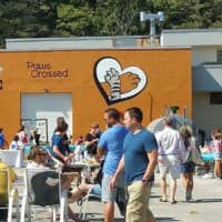 <p>Crowds turned out to help Paws Crossed Animal Rescue celebrate its grand opening Saturday in Elmsford.</p>