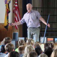 <p>Peter Lourie entertains Royle fourth graders with his stories.</p>
