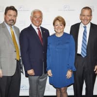 <p>Left to Right: Board Vice Chairman Peter Rugen, emcee Bobby Valentine, Diane Bosek and Board Chairman Jim Bosek.</p>