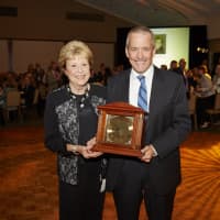 <p>Board Chair Jim Bosek (of Darien) presented Patricia Phillips (of Stamford) with the Rays of Hope Award. Phillips co-founded the shelter nearly 35 years ago.</p>